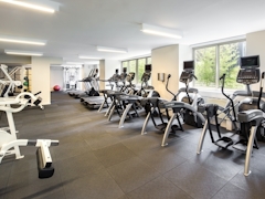 Thumbnail of Atlas New York: 22D a room filled with furniture and a table