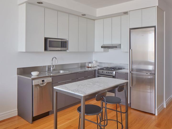 a modern kitchen with stainless steel appliances