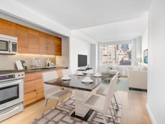 Thumbnail of Gotham West: 2717 a kitchen with a stove top oven sitting inside of a room