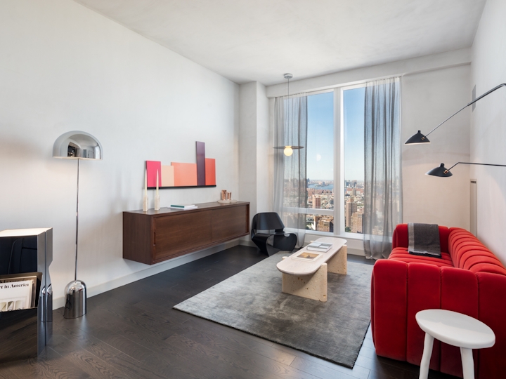 a living room filled with furniture and a flat screen tv
