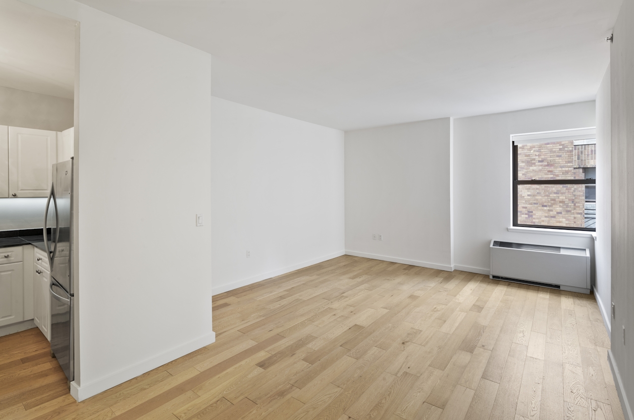 a kitchen with a wood floor