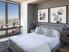 Thumbnail of The Ashland: 38K a bedroom with a large bed in a hotel room