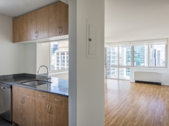 Thumbnail of Atlas New York: 22D a kitchen with a sink and a refrigerator