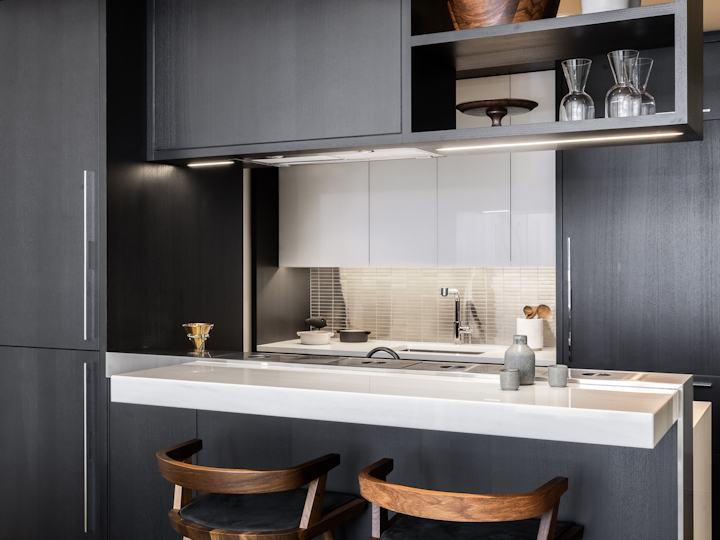 a kitchen with a sink and a mirror