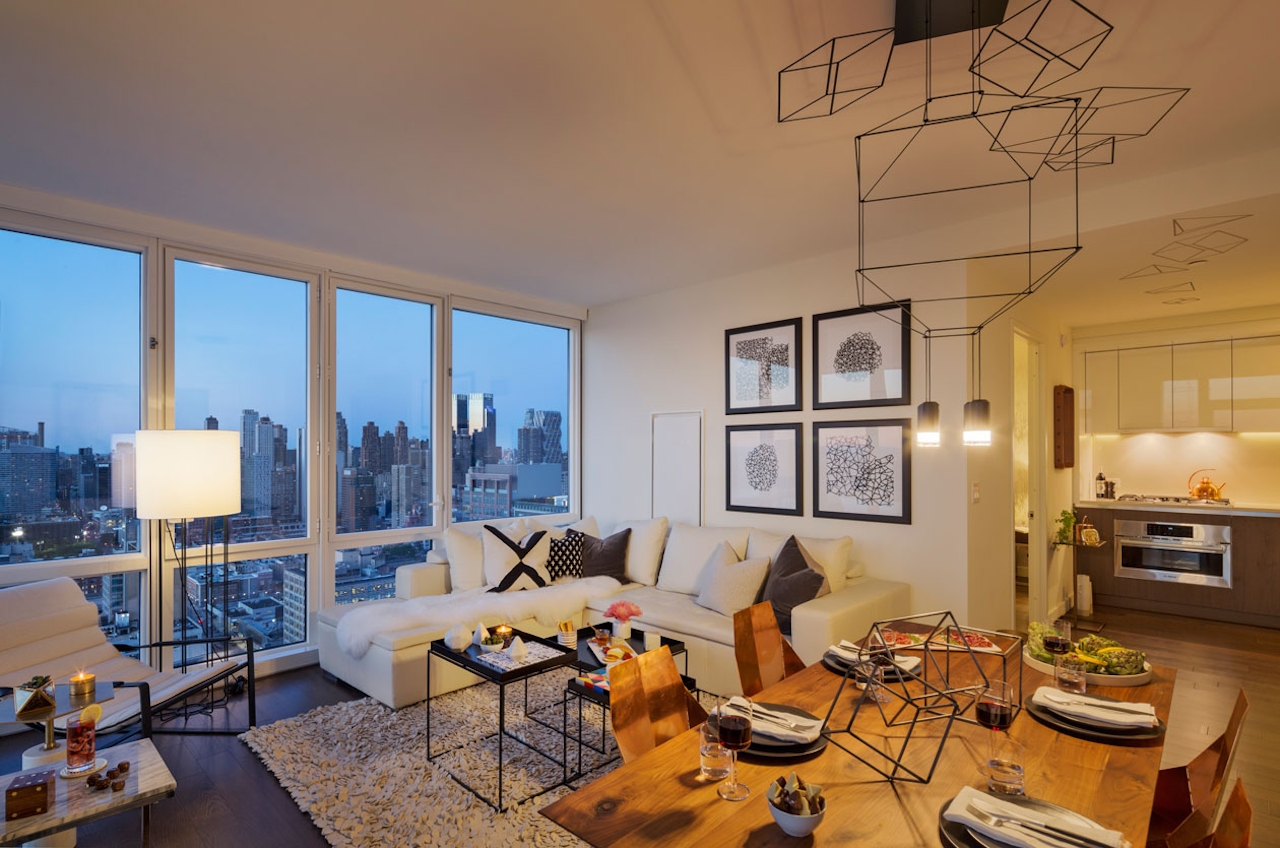 a living room filled with furniture and a large window