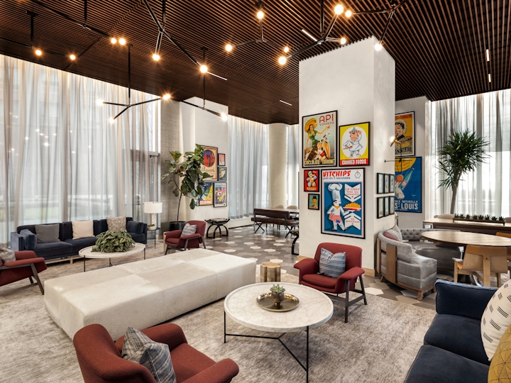 a living room filled with furniture and a large window