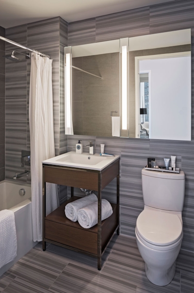 a room with a sink and a mirror