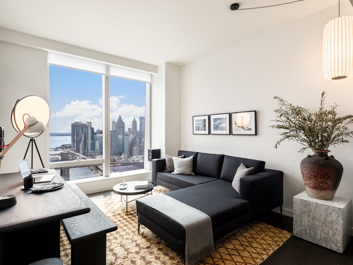 a living room filled with furniture and a flat screen tv