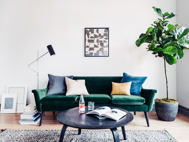 a living room filled with furniture and a rug