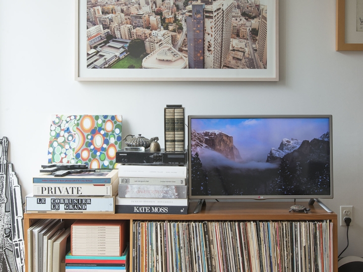 a living room filled with furniture and a tv