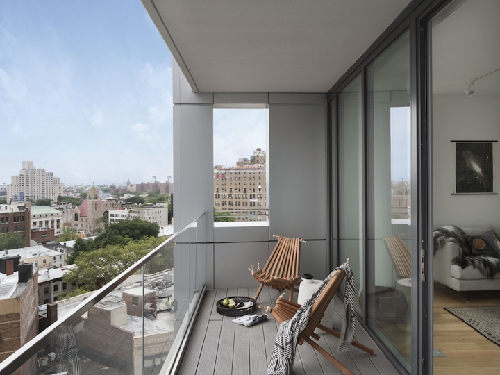 a view of a living area with a building in the background
