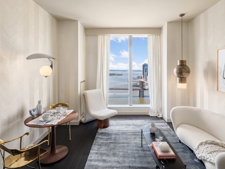 a living room filled with furniture and a large window