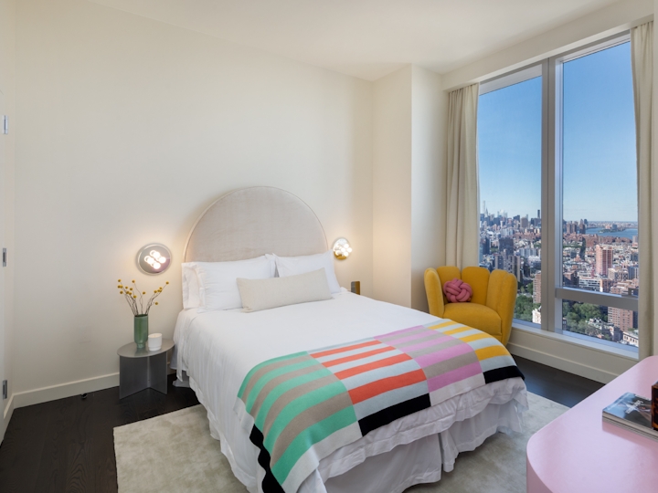 a bedroom with a large bed in a room